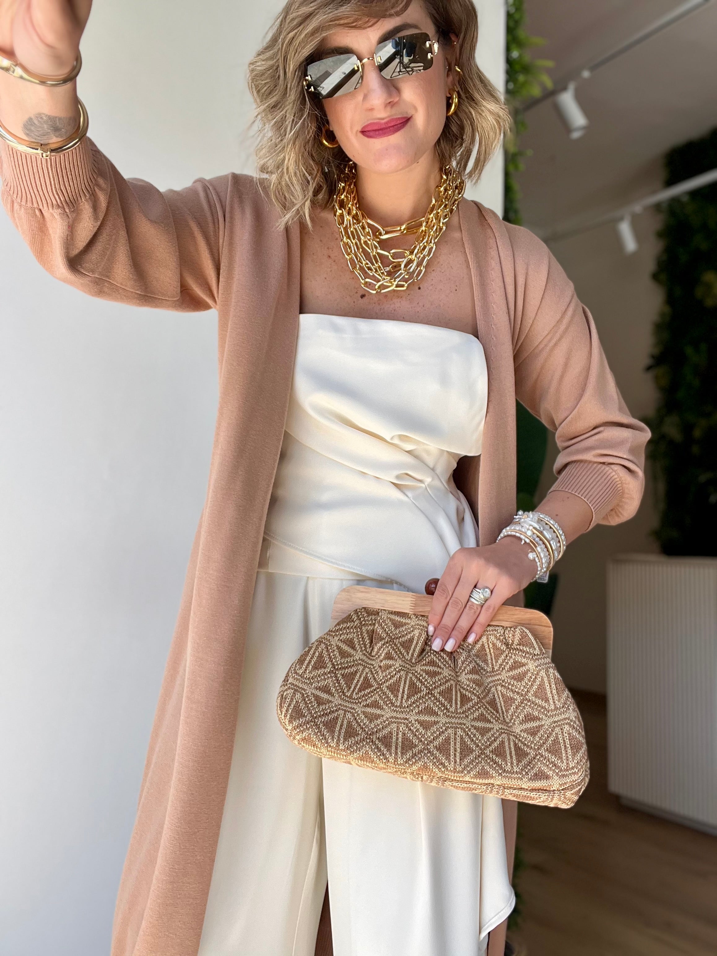 Pochette a fantasia con manico in legno