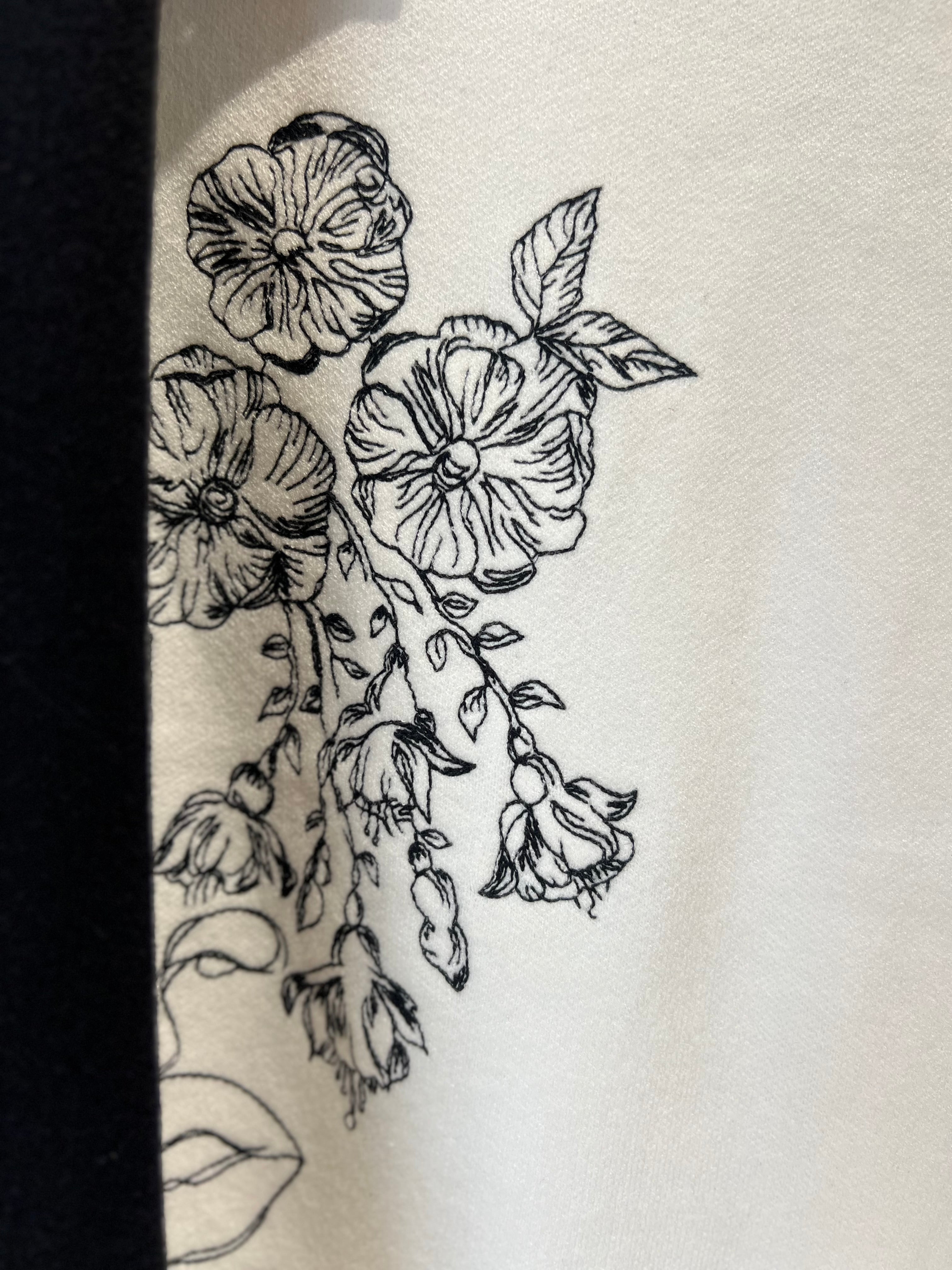 Gilet in maglina con volto ricamato